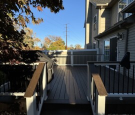 Bethlehem, PA Timbertech composite decking with cocktail white vinyl railing and black balusters built in Bethlehem, PA.