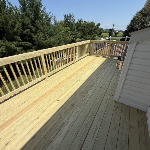 PT Lumber decking with 2x4 railing and square balusters built in Center Valley, PA.